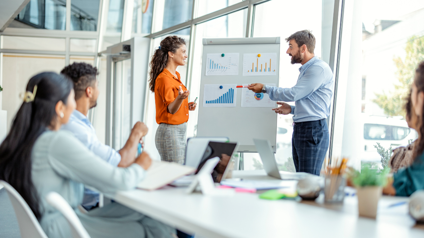 A workplace team engaged in an open conversation, representing how mediation services support empowered, collaborative teams